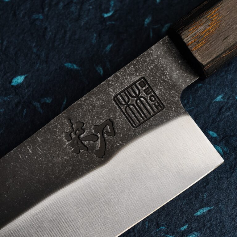 Close-up of FRIGG's blade with the stamped character mark and the BECH seal