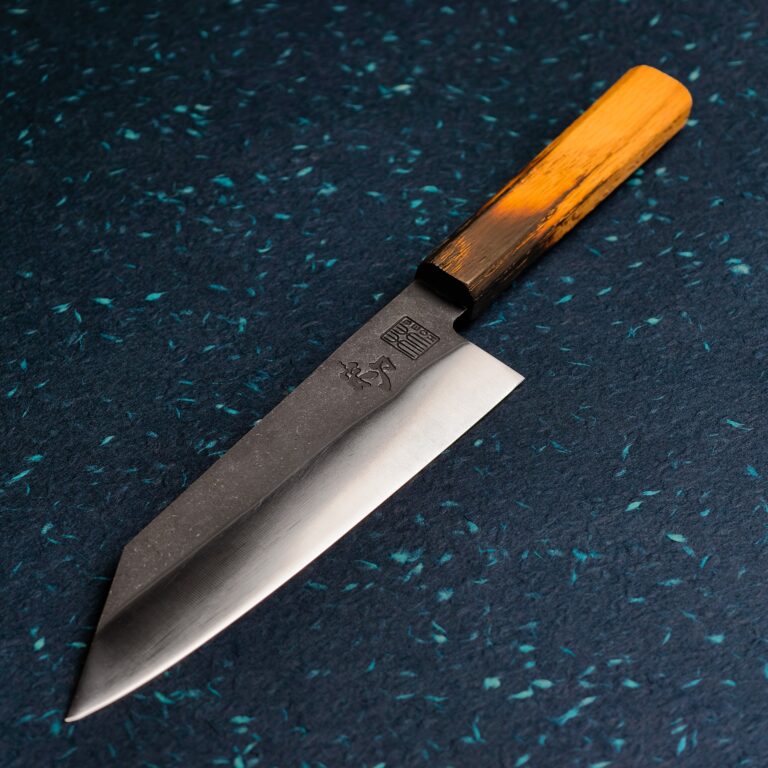 FRIGG santoku on a dark speckled surface