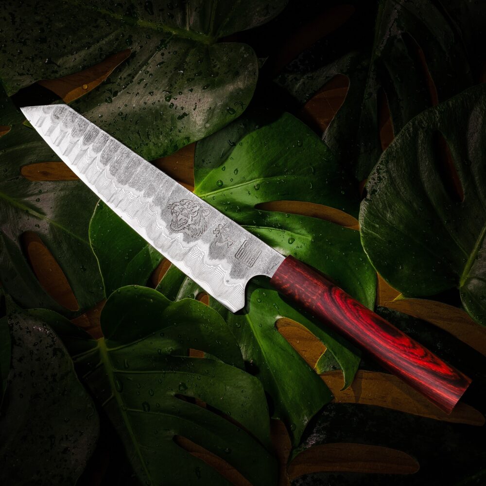 TIGRITUDE III Damascus kiritsuke knife with an angled tip, patterned blade and red-brown handle.