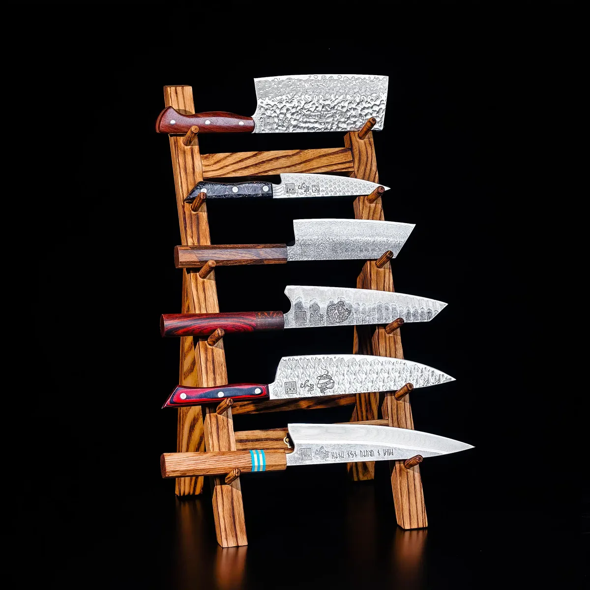 EX-ANIMO III Damascus knife set: six knives displayed on a wooden stand.