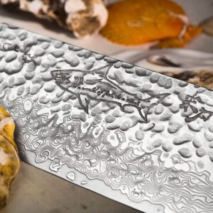 SHARK II cleaver blade with a shark motif, dimpled texture and flowing lines near the cutting edge.