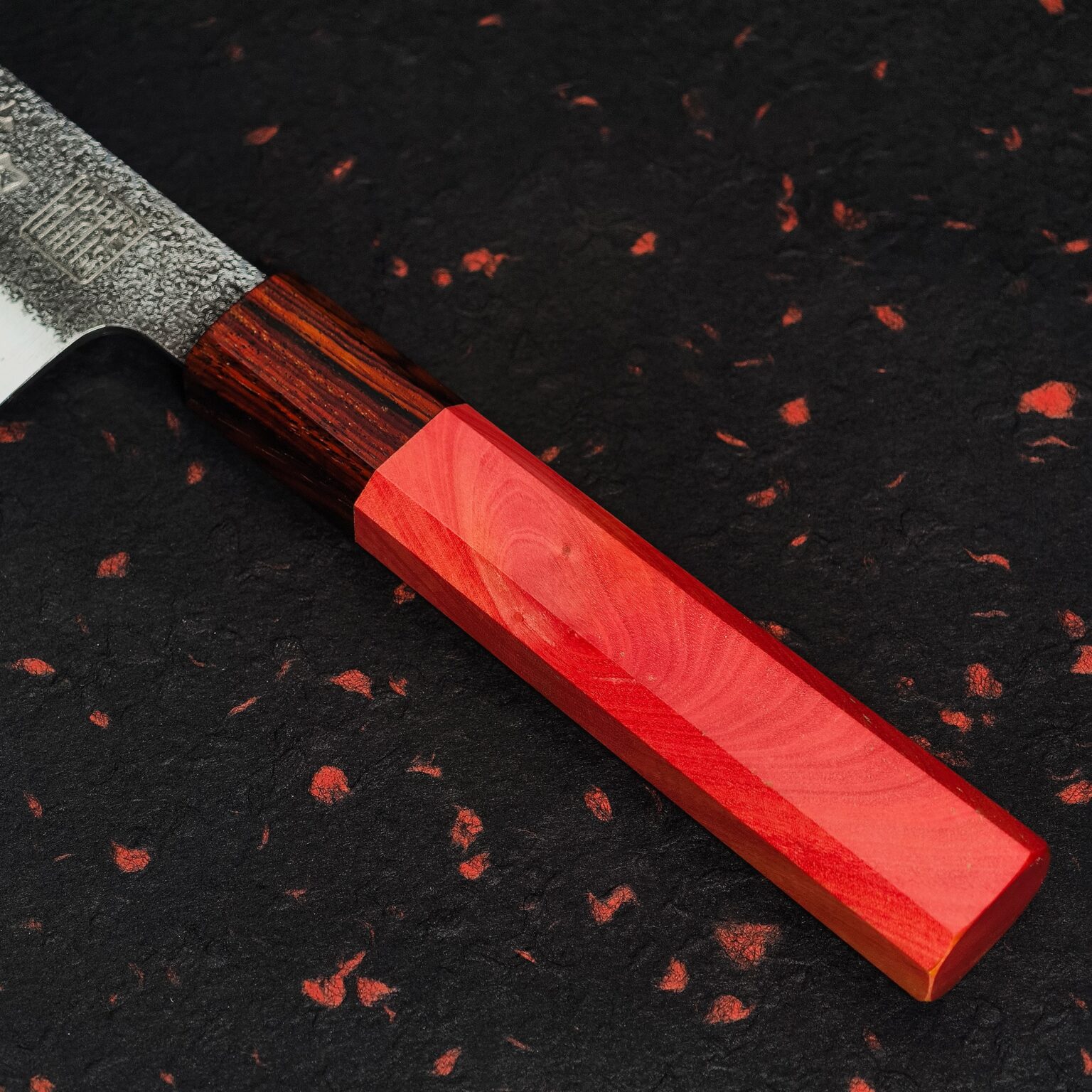 Handle: a dark striped Cocobolo section beside the Pink Oak body