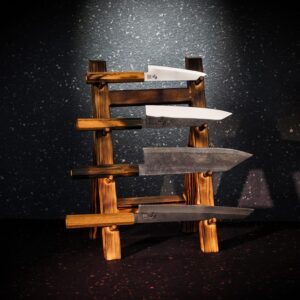 The four RAW OAK knives, ODIN, FRIGG, TYR and FREYA, on an oak knife stand