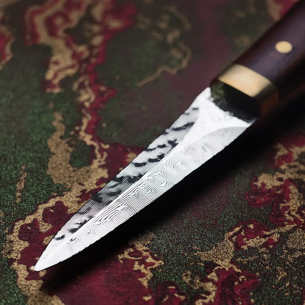 Close-up of the Damascus blade of the RICEKNIFE cocobolo oyster knife