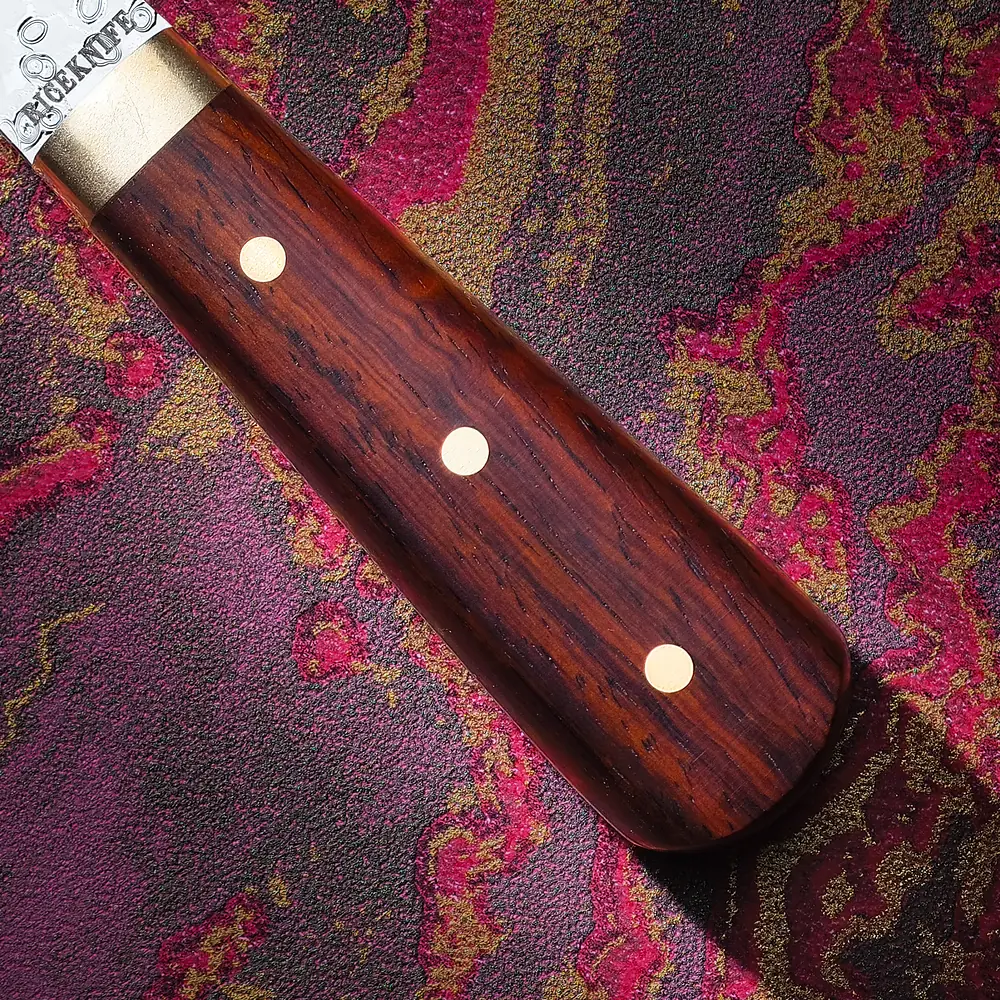 Cocobolo handle close-up with three pins